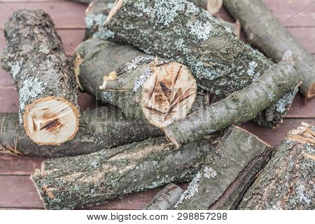 Many Dry Firewood In The Wooden Table