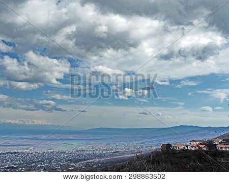 Top View Of Alazani Valley In Georgia In Springtime, In The Distance Through The Haze Visible To The
