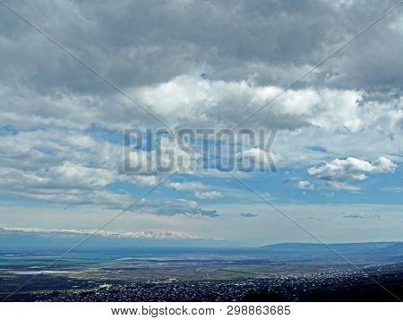 Top View Of Alazani Valley In Georgia In Springtime, In The Distance Through The Haze Visible To The