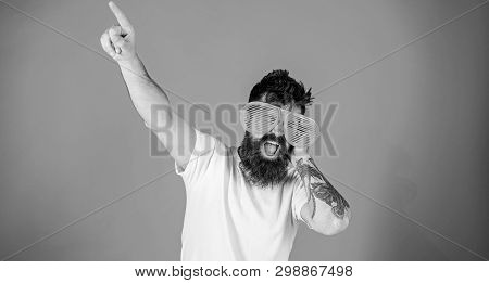Man Bearded Hipster Wears Giant Louvered Sunglasses. Sunglasses Accessory Gives Incredible Feeling O