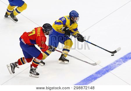 Kyiv, Ukraine - April 20, 2018: Remus Gheorghe Of Romania (l) Fights For A Puck With Daniil Duiun Of