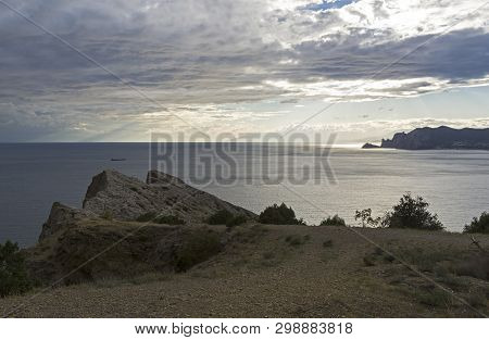 Clouds Over The Sea Beautifully Illuminated By The Evening Sun. View From The Top Of Alchak Cape. Su
