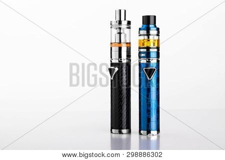 Electronic Cigarettes Or Vaping Devices On White Background