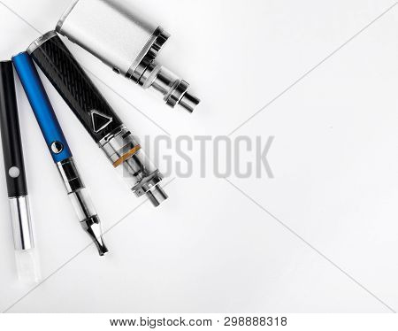 Electronic Cigarettes Or Vaping Devices On White Background