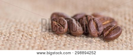 Cloceup Of Brown Roasted Coffee Beans Seeds On Burlap Textile Background Black Caffeine Drink And En