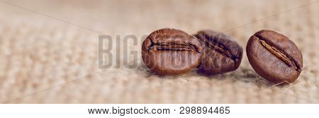 Cloceup Of Brown Roasted Coffee Beans Seeds On Burlap Textile Background Black Caffeine Drink And En