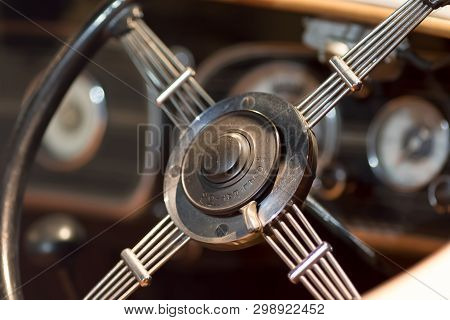 Vintage Dual Ratio Car Steering Wheel Close-up. History Of Driving. Dual-ratio Metal Motor Steering 