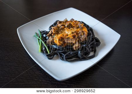 Black Pasta With Cuttlefish Ink. Pasta Of Durum Wheat Semolina With Squid Ink With Beef And Sweet Pe