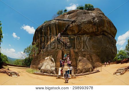 Sigiriya, Sri Lanka - May 20, 2011: Tourists Climb Sigiriya Lion Rock Fortress In Sigiriya, Sri Lank