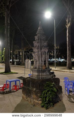 Siem Reap, Cambodia, December 13, 2018 A Small Buddhist Altar In The Park. A Table And Several Plast
