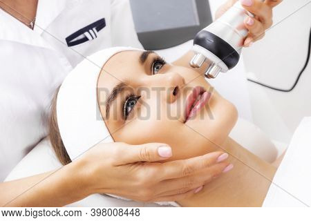 Photo Vacuum Rf Face Lifting. Biostimulation In A Beauty Salon. Skin Rejuvenation. Radio Wave Liftin