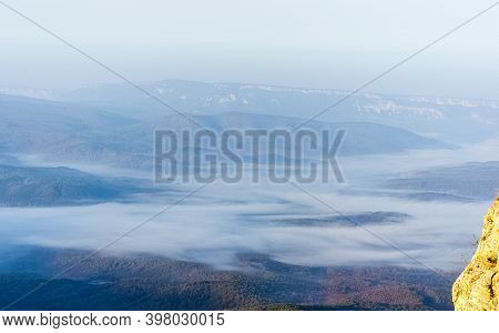 Mountains And Forests Of Crimea. Coniferous And Deciduous Trees On The Hills Of The Mountains And Ro