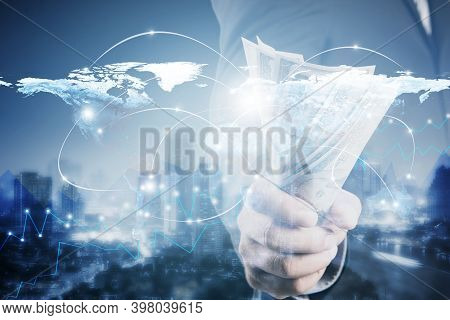 Double Exposure Of Businessman With Money In Hand On Cityscape Blurred Building And Worldmap Connect