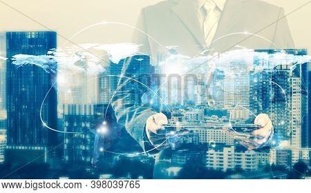 Double Exposure Of Success Businessman Using Digital Tablet With City Landscape Background.connectio