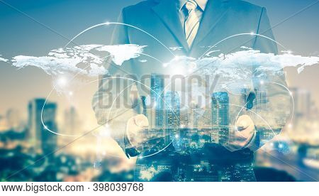 Double Exposure Of Success Businessman Using Digital Tablet With City Landscape Background. Night Vi