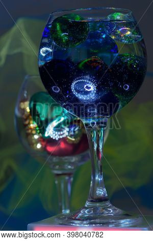 Christmas Decorations And Colorful Multi Color Glass Balls In Sparkles Ambilight Wine Glasses. Beaut