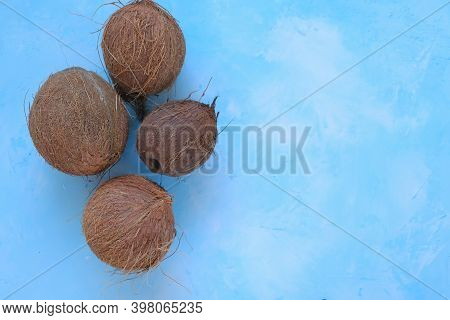 Coconuts Set Close-up On A Light Blue Background.fresh Coconut Group.raw Materials For Food And Cosm
