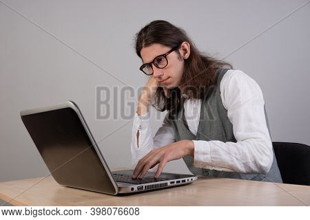 Geek Guy Is Trying To Write Code Or Learn A New Programming Language, Experience Difficulties In The