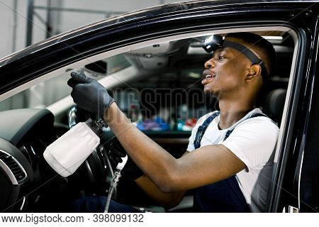 Professional Air Chemical Cleaning Of Car Interior With Air Tornador Gun. Close Up Of African Worker