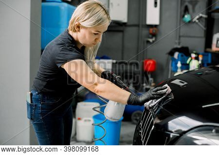Pretty Young Female Worker Of Car Wash And Detailing Service, Performing Cleaning Of Car Radiator Gr