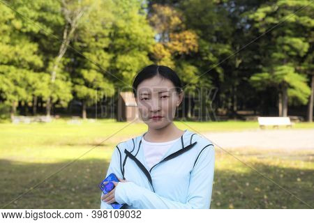 A Chinese Woman With A Stern Look At Burr Pond State Park In Torrington, Connecticut In Early Autumn