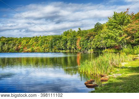 Early Autumn Day At Burr Pond State Park In Torrington, Connecticut On A Sunny Blue Sky Day.