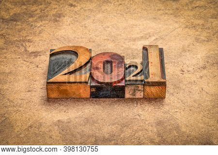 2021 year in vintage, gritty letterpress wood type against handmade bark paper, New Year concept