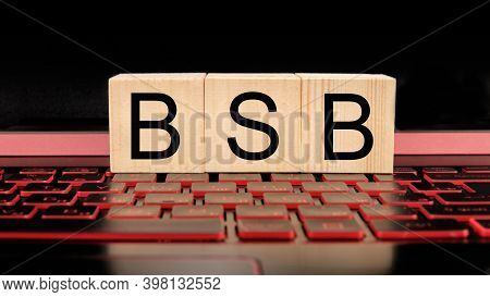 Wooden Blocks With Bsb Text On Laptop Keyboard, Business Concept
