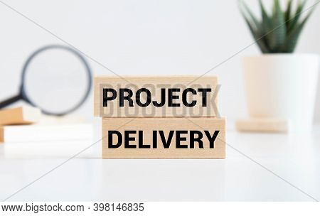 The Inscription On The Yellow Sheet For Notes Text Project Delivery Which Is Attached To The Noteboo