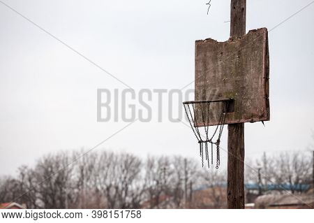 Old, Half Destroyed, Rotten Basketball Backboard, In A Decaying Sports Playground, Standing During A