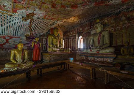 Dambulla, Sri Lanka - February 08, 2020: Interior Of A Ancient Buddhist Cave Temple. The Golden Temp