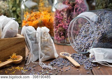 Filter Tea Bags Filled With Medicinal Herbs. Glass Jar Of Dry Lavender Flowers For Making Herbal Tea