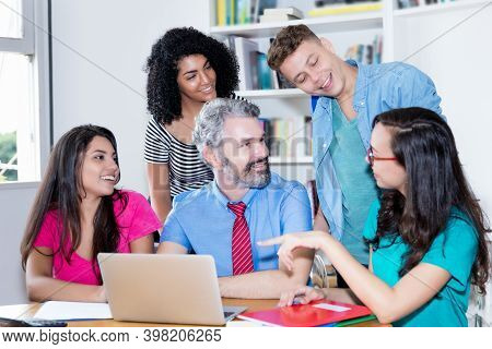 Teacher Explainig Programming And Coding Of Software To Computer Science Students At Classroom Of Un
