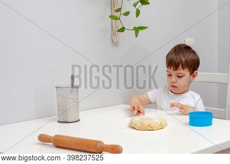 Little Boy Helps Mother To Cook  Making Homemade Coockies. Casual Lifestyle In Home Interior, Pretty