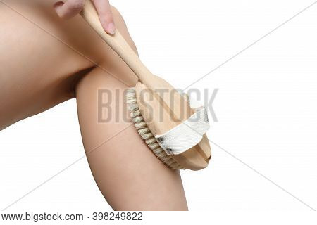 Dry Brush Massage Concept. Woman Using Brush For Massaging Body Isolated On White Background. Leg Of