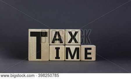 Tax Time Symbol. Concept Words 'tax Time' On Wooden Cubes On A Beautiful Grey Background. Business A