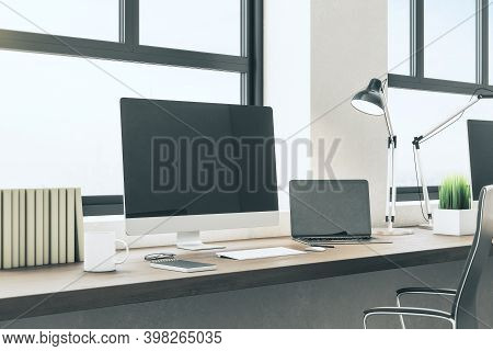 Modern Designer Desktop With Empty Black Computer Screen, Lamp On Table And City View. Mock Up, 3d R