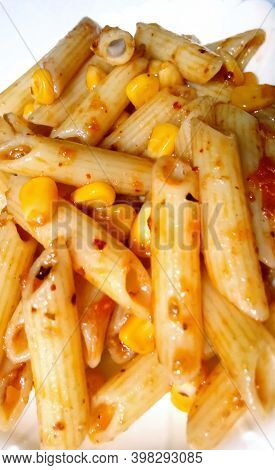 Closup Of Penne Pasta With Tomato Sauce