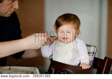Father Feeding Baby Girl From Spoon Mashed Vegetables And Puree. Food, Child, Feeding And People Con