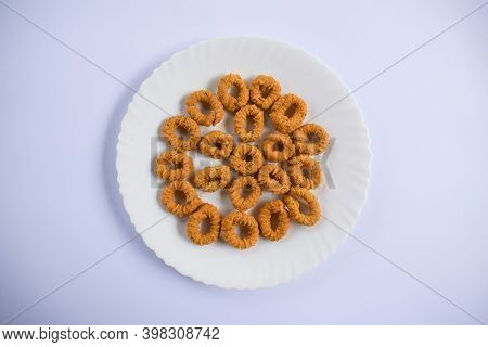 Top View Of South Indian Traditional Snack Item, Evening Tea Time Item Chegodilu Or Ring Murukku Iso