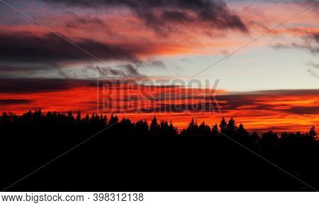 Red Sunset With Forest In Backlight At Roback