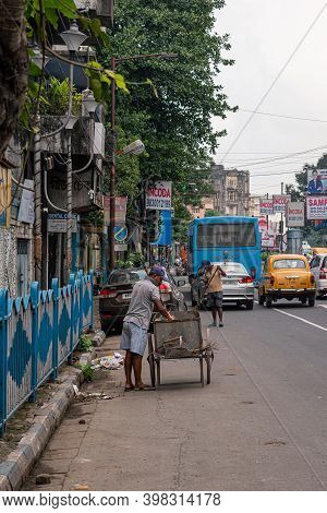 A Sweeper Sweeps The Street Of Kolkata, India On October 2020