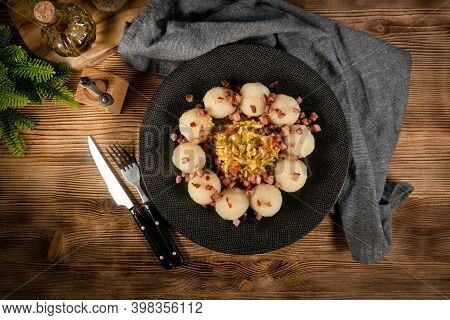 Meat Stuffed Potato Dumplings With Fried Onion And Greaves.