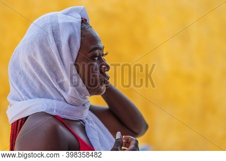 African Woman Wearing A White Shawl In The Tropical Village Of Keta Ghana West Africa