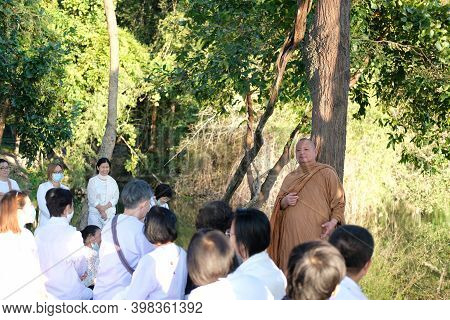 Buddhist Monk Teaching Dhamma To People
