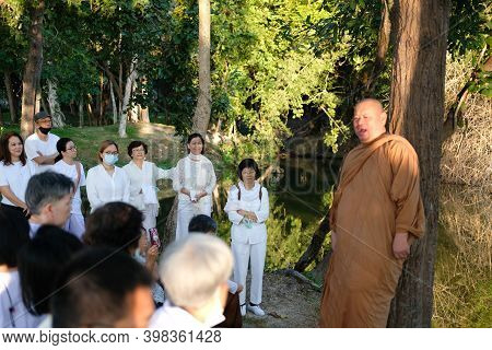 Buddhist Monk Teaching Dhamma To People