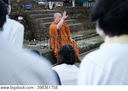 Buddhist Monk Teaching Dhamma To People