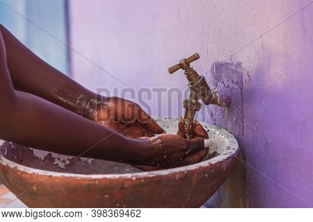 African Woman Washes Her Hands Outdoors In A Small Village Keta Ghana West Africa