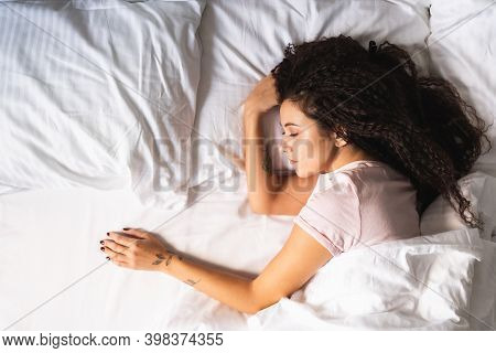Young Afro-haired Upset Woman Alone In Bed With Empty Space Next To Her. Divorse, Loss Of Love Conce