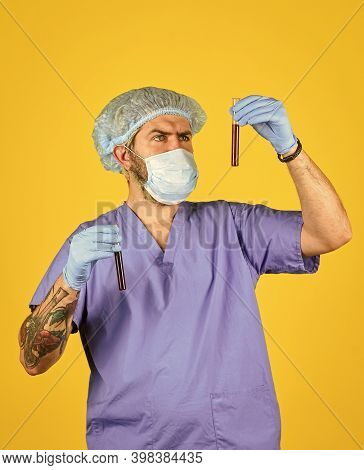 Nurse Man Wear Respirator Mask Hold Blood Test. Symptoms Of Acute Respiratory Infection. New Virus S